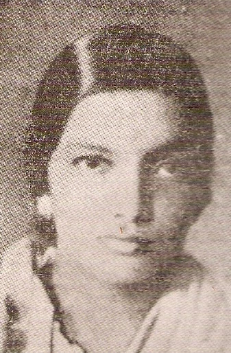 Archival halftone portrait of a young Kalpana Datta, head and shoulders, hair parted and drawn back, looking slightly to her left.